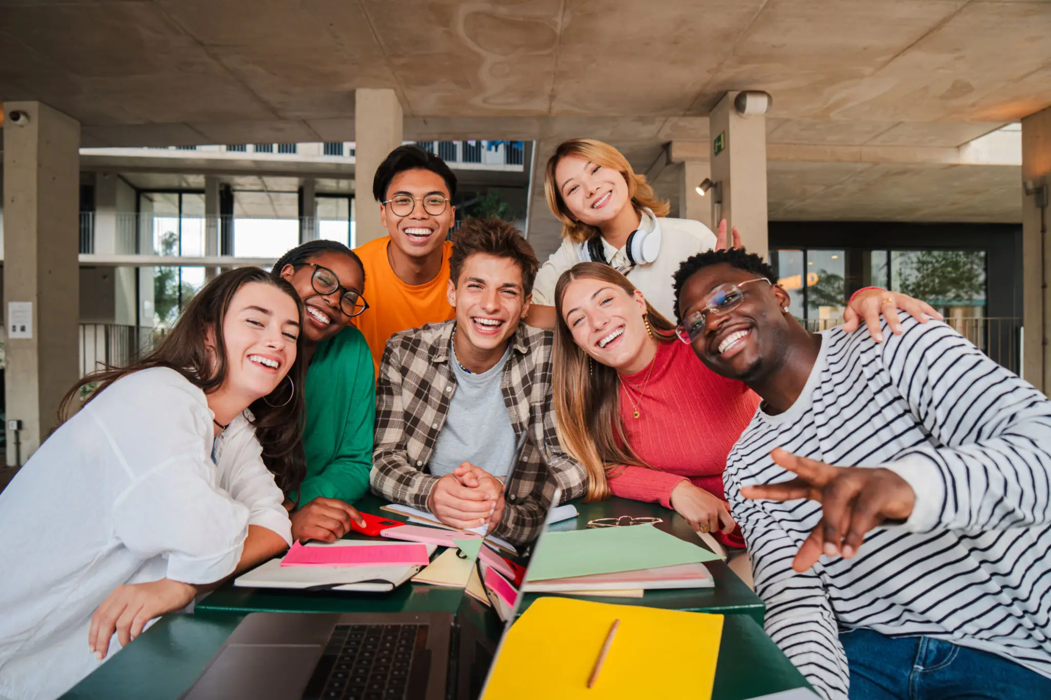 Group of smiling friends at a table.
